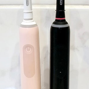 Stojak na szczoteczkę do zębów / uchwyt na główkę do szczoteczek elektrycznych Braun Oral B