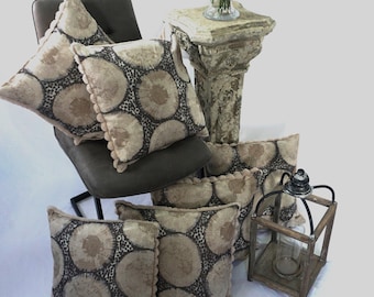 Cushions with a neutral/dark grey pattern print