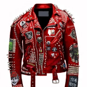 May include: A red leather jacket adorned with metal studs and patches. The jacket has a front zip, pockets, and a belt. The back features a graphic of a smiling face and the word "PUNKS!!". The jacket is covered in metal spikes.