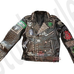 May include: Black leather jacket with silver studs and various band patches, including "Misfits", "Maniac", and "Sex Pistols".