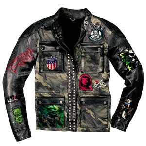 May include: A black leather jacket with camouflage fabric and multiple patches. Patches include a skull, Frankenstein, and Che Guevara. The jacket has a studded front closure and multiple pockets. The sleeves are black leather.