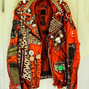 Men’s Tangerine Heretic Jacket – Punk Cut with Leopard Print, Gothic Patches & Spiked Shoulder Armor
