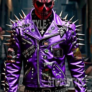 May include: A purple leather jacket with gold spikes on the shoulders. The jacket has multiple patches, zippers, and the text "Awaiting Fear". The person in the image is wearing a red skull mask.