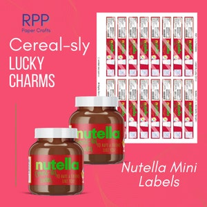 May include: Two glass jars filled with brown hazelnut spread, each featuring a red label with the green Nutella logo and the text Cereal-sly lucky to have a friend like you. A sheet of matching rectangular adhesive labels is displayed alongside.
