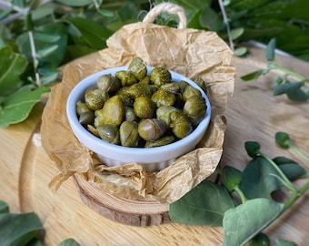 Salt capers. Sicilian wild organic capers. Island capers. Italian capers in sea salt. Italian appetizer. Mediterranean diet.