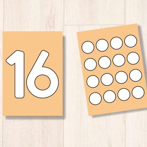 Puede incluir: Una hoja de trabajo imprimible con el n&uacute;mero 16 y una cuadr&iacute;cula de 16 c&iacute;rculos. La hoja de trabajo est&aacute; sobre un fondo melocot&oacute;n.