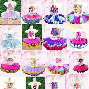May include: A collection of 12 personalized tutu outfits for girls. Each outfit features a white t-shirt with a number, a character image, and a name. The tutus are made of tulle and come in a variety of colors, including pink, purple, blue, and orange.