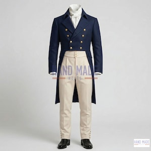 May include: A navy blue double-breasted coat with gold buttons, paired with cream-colored trousers and a white ascot. The formal attire is completed with black dress shoes. The text "HAND MADE KITS" is visible on the trousers.