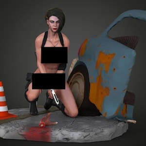 May include: A woman in a black outfit is kneeling next to a wrecked car. She is holding a gun in her right hand. There is a traffic cone in the foreground and a severed hand on the ground.
