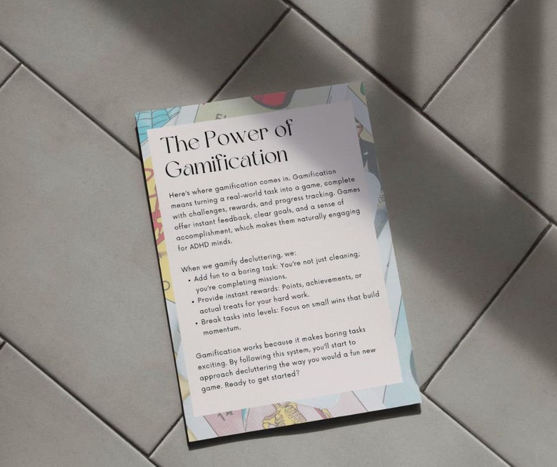 May include: A rectangular card with the title "The Power of Gamification" and explanatory text. The card has a light background with colorful floral-like designs around the edges. The text describes how to make tasks more engaging.