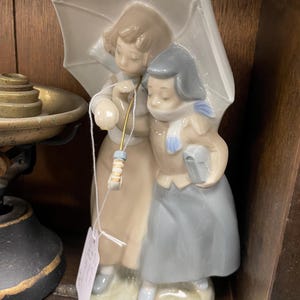 Zaphir by Lladro &#39;it&#39;s raining&#39;
