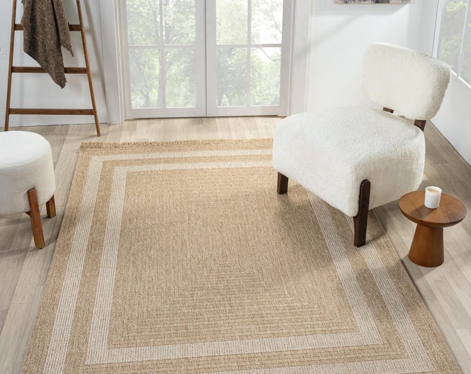 Durable and long-lasting machine-woven jute rug with white border.