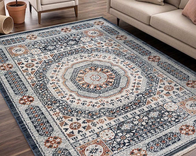 Blue rug with Mamluk-style patterns, rug with ethnic patterns and a distressed look, traditional-motif Turkish-style rug in beige and blue.