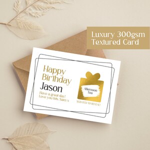 May include: A white card with black text that reads "Happy Birthday Jason Have a great day! Love you lots, Sam x". The card features a gold foil gift box with a scratch-off area that says "Afternoon Tea" and "Scratch to Reveal!"