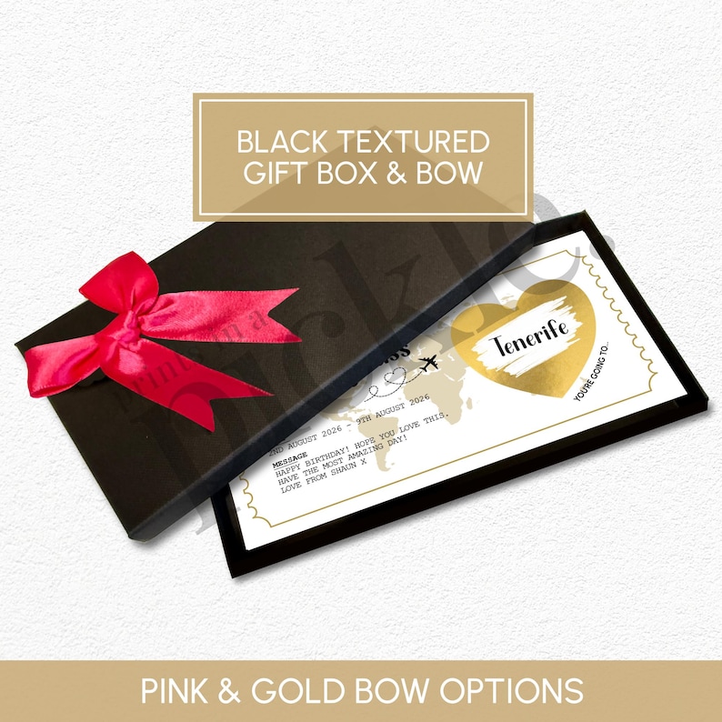 May include: A black textured gift box with a red bow. Inside, a card with a gold heart that says "Tenerife" is visible. The card includes a message and the text "You're going to..."