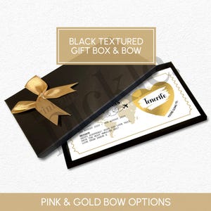 May include: A black textured gift box with a gold bow. Inside, a card with a gold heart that says "Tenerife" and a message. The text on the box reads "Black Textured Gift Box & Bow" and "Pink & Gold Bow Options".