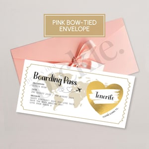 May include: A boarding pass design with a gold heart that says "Tenerife" is displayed on a white background. The pass is inside a pink envelope with a pink bow. The text on the pass includes the passenger's name, date, and a message.