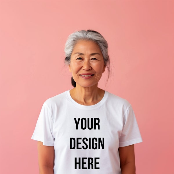 Asian senior woman white t-shirt mockup simple blank tee mockups front view studio shot light pink background old lady