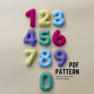 May include: A set of plush numbers in various colours, including pink, yellow, blue, purple, green, and magenta. The numbers range from zero to nine. The text "PDF PATTERN" and "+PHOTO AND TEXT INSTRUCTIONS" are also visible.