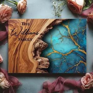 May include: A rectangular wooden sign with the text "THE Williams FAMILY" in elegant script. The sign features a natural wood grain pattern on the left and a turquoise and gold resin design on the right. The image is surrounded by pink roses and flowing fabric.