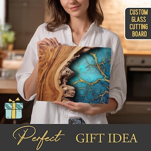 May include: A rectangular glass cutting board with a unique design. The board features a combination of wood grain and a turquoise stone pattern with gold veining. Text on the board reads "CUSTOM GLASS CUTTING BOARD". The words "Perfect GIFT IDEA" are also displayed.