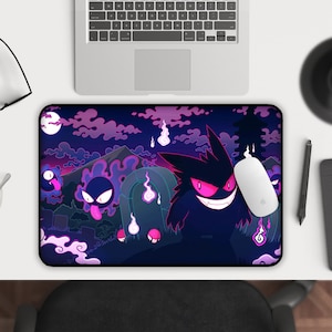 May include: A black and purple mousepad with a graphic of a cartoon ghost-like Pokemon character with glowing red eyes. The background is a dark purple with clouds and a full moon.