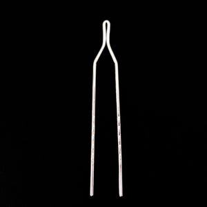 May include: A slender, silver-colored hair pin against a black background. The pin has a looped top and two parallel, straight prongs. The design is simple and elegant, suitable for various hairstyles.