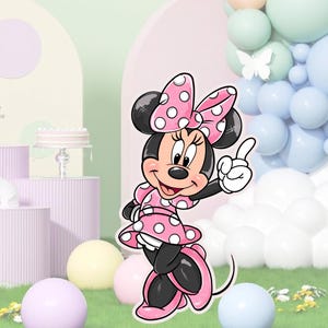 K&ouml;nnte beinhalten: Ein pinkfarbener und wei&szlig;er Polka-Dot-Minnie-Maus-Ausschnitt mit einer rosa Schleife und einem wei&szlig;en Hintergrund.