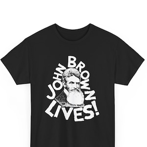 May include: Black t-shirt with a white graphic of John Brown's portrait and the text "JOHN BROWN LIVES!"