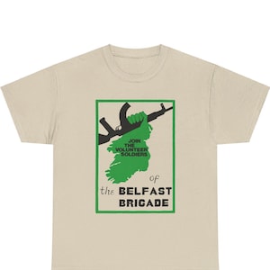 May include: A beige t-shirt with a black and green graphic print of a hand holding a rifle and the text "Join the Volunteer Soldiers of the Belfast Brigade".