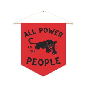 May include: A red pennant banner with the text "All Power to the People" in black lettering. A black panther silhouette is centred above the text.