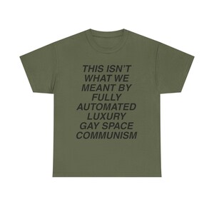 luxury gay space communism pride shirt this isnt what we meant tee queer leftist meme shirt lgbt pride space tourism parody anti billionaire gay space communism meme doomcore weirdcore sarcastic funny protest t shirt pride meme apparel nihilist humor class war clothing blue origin parody katy perry space flight satire fully automated luxury gay space communism quote queer liberation pride month shirt socialist anarchist activist tee soft cotton unisex union printed