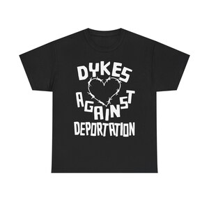 dykes against deportation shirt barbed wire heart tee queer immigrant solidarity abolish ice apparel lesbian protest wear radical pride lgbt migrant justice class war clothing no human illegal activist anti fascist leftist t shirt pride 2025 queer mutual aid detention abolition free them all anti border tee socialist pride unisex graphic the first pride was a riot stonewall t-shirt radical queer liberation no human being is illegal abolish ice abolish borders lesbian anarchist queer anarchism