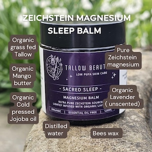 Puede incluir: Un tarro de 120 ml de b&aacute;lsamo de magnesio Tallow Beauty Sacred Sleep con tapa negra y etiqueta morada. El texto incluye ZEICHSTEIN MAGNESIUM SLEEP BALM, TALLOW BEAUTY e ingredientes como sebo org&aacute;nico, manteca de mango, aceite de jojoba y cera de abejas.