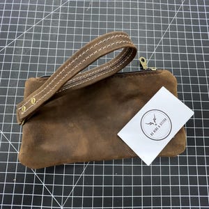 Cartera de mano de cuero