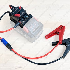 May include: A black and red jump starter with a 30A fuse and a waterproof switch. The jump starter is connected to a red and black jumper cable set with alligator clips.