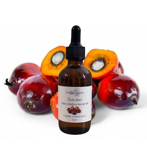 May include: A brown glass bottle of Batana oil with a black dropper, labeled "Emilia Organics." The label reads "Batana, Elaeis Oleifera Kernel Oil, Organic, cold pressed, 2 oz." The bottle is surrounded by red and orange palm fruits.