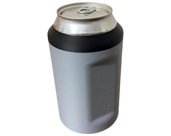 May include: A gray and black Speedload Cozie with the word "COORS" in red at the top. The cozie is designed to hold a can. The words "SPEEDLOAD COZIE" are printed in red at the bottom.