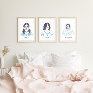 May include: Three framed illustrations of women with the words "Aprecia", "Cada", and "Momento" printed below each image.