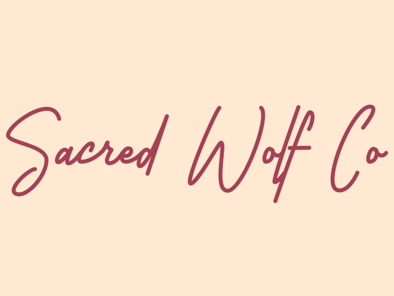 Op de afbeelding: Een logo voor een bedrijf genaamd "Sacred Wolf Co."