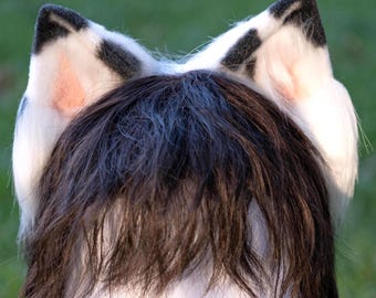 White cat with black dots ears and tail, furry cosplay, lifelike animal ears, cute kawaii anime manga neko