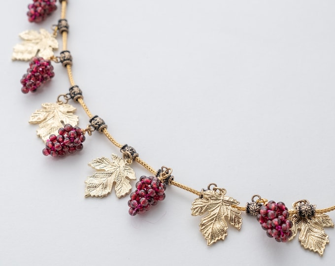 Replica archaeological revival necklace, designed by Castellani, 19th Century, alloy steel and garnet, vine leaves grapes