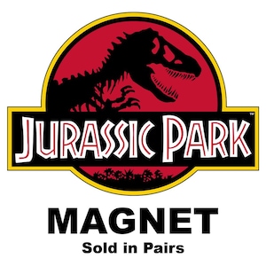 May include: A pair of red, yellow, and black Jurassic Park logo magnets. The logo features a dinosaur skeleton and the text "Jurassic Park". The text "Magnet" and "Sold in Pairs" is printed below the logo.