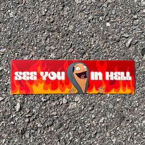May include: A red and yellow sticker with flames and the text "See you in hell" in white. A cartoon character with a grey hooded sweatshirt is in the center of the sticker.