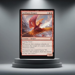 May include: A red Goldspan Dragon trading card. The card features a dragon with red wings and a mountain background. The card text includes "Flying, haste" and other game instructions. The card is displayed on a grey pedestal.