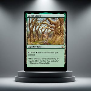 Pode incluir: Uma carta colecionável Gaea's Cradle com borda verde e ilustração de árvores estilizadas. O texto diz Gaea's Cradle, Legendary Land, Add a green mana symbol for each creature you control, e uma citação de Gamelen, Citanul elder.
