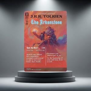 May include: A rectangular trading card featuring a fantasy illustration of a bearded figure holding a glowing orb. The text reads J.R.R. Tolkien, The Arkenstone, Seek the Heart, Sorcery-Adventure, and game rules in a red, orange, and blue colour palette.