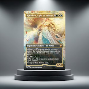 May include: A collectible trading card titled Galadriel, Light of Valinor, featuring a golden-haired figure in flowing white robes. The card text includes Legendary Creature - Elf Noble, Alliance ability details, and a power and toughness of 3/3.