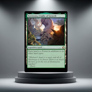 May include: A rectangular trading card titled Yavimaya, Cradle of Growth. The card features a green border and an illustration of a dense, mystical forest with large, twisted trees. Text includes Legendary Land and a quote by Karn.