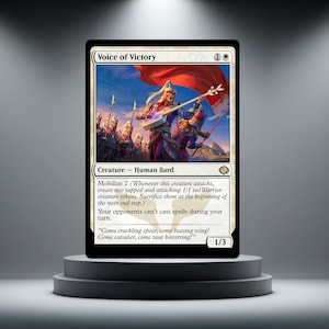 May include: A Magic: The Gathering card named "Voice of Victory" showing a Human Bard. The card has a white border with text detailing its abilities and a power/toughness of 1/3. The illustration depicts a battle scene with warriors and a musician.